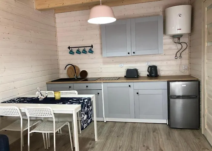 Деревянный коттедж Kapitanskie Z Prywatnym Polem Do Gry W Mini Golf Реваль